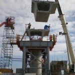 Lifting another GuidewaySegment into place in preparation for connection to Miami International Airport MetroRail System